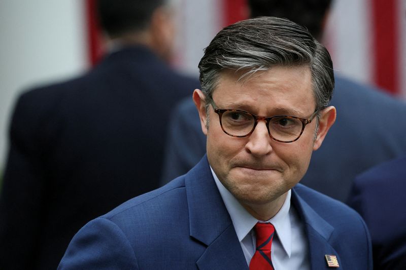 FILE PHOTO: U.S. House of Representatives Speaker Mike Johnson (R-LA) looks on, after President Donald Trump delivered remarks on tariffs, in the Rose Garden at the White House in Washington, D.C., U.S., April 2, 2025. REUTERS/Leah Millis/File Photo