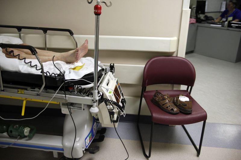 FILE PHOTO: A patient waits in the hallway for a room to open up inside the emergency room at Ben Taub General Hospital in Houston, Texas July 27, 2009. REUTERS/Jessica Rinaldi/File photo