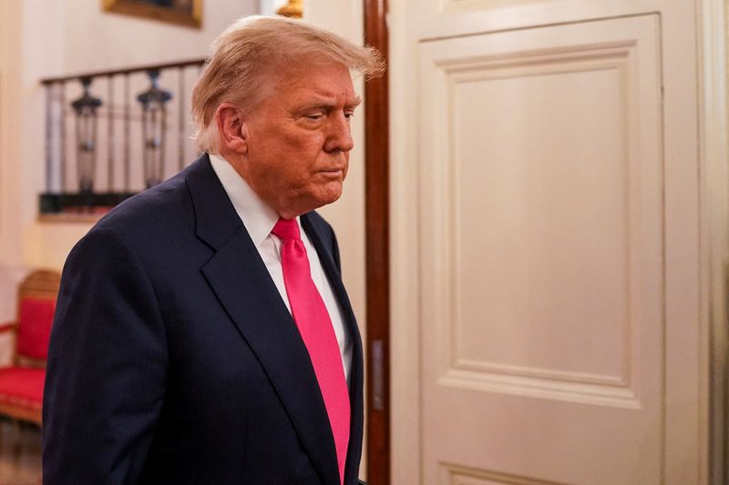 FILE PHOTO: U.S. President Donald Trump walks on the day of a "One Big Beautiful" event at the White House in Washington, DC., U.S., June 26, 2025. REUTERS/Nathan Howard/File Photo