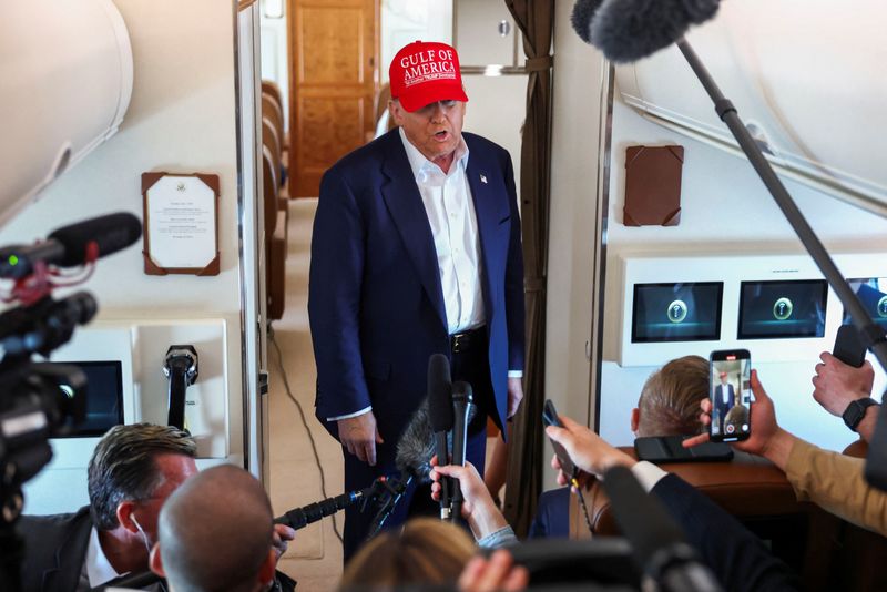 U.S. President Donald Trump speaks to reporters aboard Air Force One en route to Joint Base Andrews, Maryland, after touring a temporary migrant detention center informally known as "Alligator Alcatraz" in Ochopee, Florida, U.S., July 1, 2025. REUTERS/Evelyn Hockstein