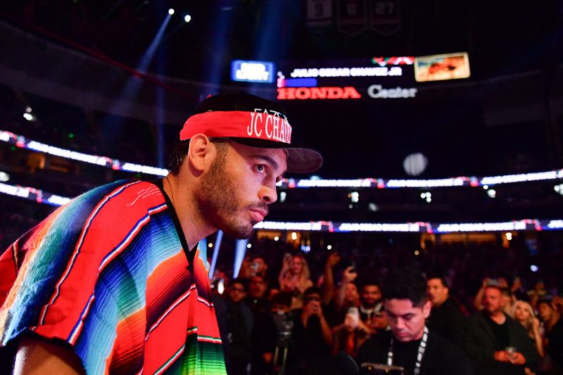 FILE PHOTO: Mexican boxer Julio Cesar Chavez Jr. enters the ring before his fight against Jake Paul at Honda Center in Anaheim, California, U.S. June 28, 2025.  Gary A. Vasquez-Imagn Images via REUTERS/File Photo