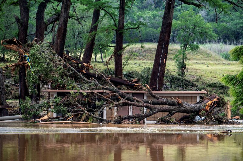 A small building sits in water after deadly flooding in Ingram, Texas, U.S., July 5, 2025.   REUTERS/Sergio Flores