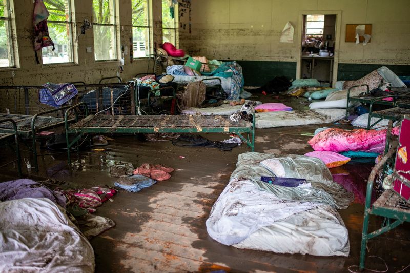 Items lie scattered inside a cabin at Camp Mystic after deadly flooding in Kerr County, Texas, U.S., July 5, 2025.   REUTERS/Sergio Flores