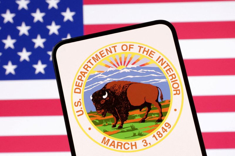 FILE PHOTO: United States Department of the Interior logo and U.S. flag are seen in this illustration taken April 23, 2025. REUTERS/Dado Ruvic/Illustration/File Photo