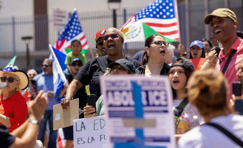 FILE PHOTO: The crowd chants outside the Civic Center at the conclusion of a 'cabalgata' for human rights, following multiple detentions by Immigration and Customs Enforcement (ICE), in the Los Angeles County city of Compton, California, U.S., June 22, 2025.   REUTERS/Jill Connelly/File Photo