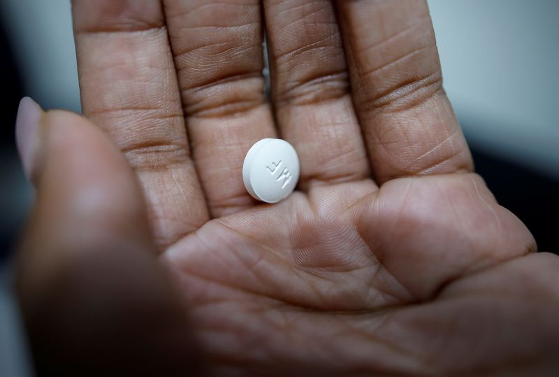 FILE PHOTO: A patient prepares to take Mifepristone, the first medication in a medical abortion, at a clinic in Carbondale, Illinois, U.S., April 20, 2023. REUTERS/Evelyn Hockstein/File Photo
