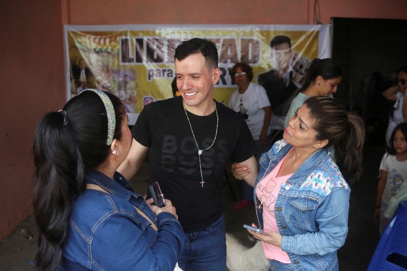 Andry Hernandez, who was held for months in an El Salvador prison after the U.S. alleged he was a member of the Tren de Aragua gang, talks with friends at his home following his release, in Tachira, Venezuela July 23, 2025. REUTERS/Carlos Eduardo Ramirez