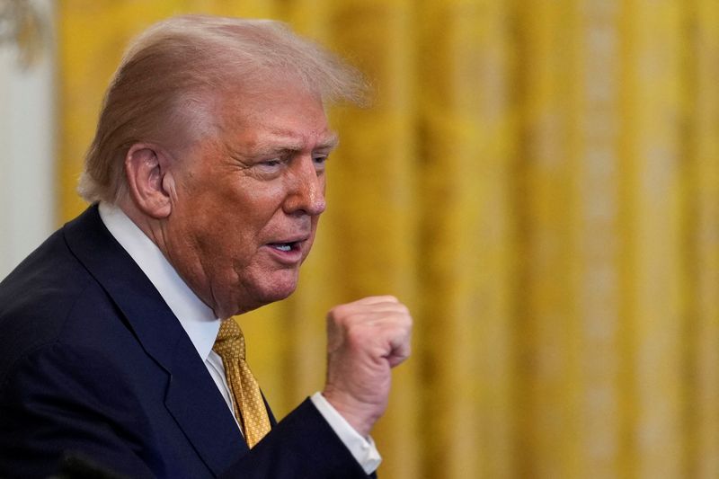 FILE PHOTO: U.S. President Donald Trump gestures as he hosts a dinner with Republican members of the U.S. Congress in the East Room of the White House in Washington, D.C., U.S., July 22, 2025. REUTERS/Kent Nishimura/File Photo