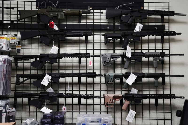AR-15 style rifles are displayed for sale at Firearms Unknown, a gun store in Oceanside, California, U.S., April 12, 2021.  REUTERS/Bing Guan/File Photo