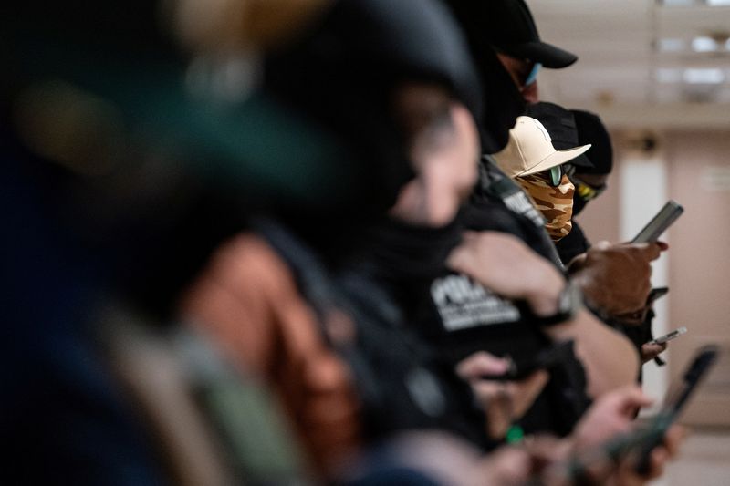 Federal immigration officers stand guard as the wait to make detainments at U.S. immigration court in Manhattan, in New York City, U.S., July 24, 2025. REUTERS/David 'Dee' Delgado