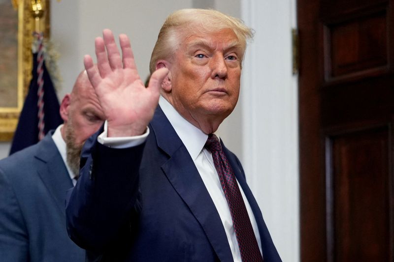 U.S. President Donald Trump waves as he leaves the Roosevelt Room after signing an executive order to reinstate the Presidential Fitness Test, at the White House in Washington, D.C., U.S., July 31, 2025. REUTERS/Kent Nishimura