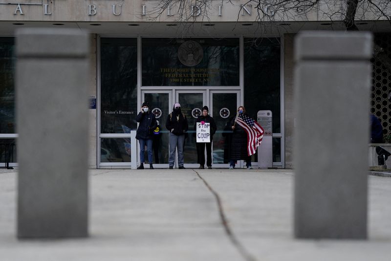 FILE PHOTO: People gather to protest outside the Office of Personnel Management (OPM) headquarters after the Department of Government Efficiency (DOGE) was charged with oversight of OPM, in Washington, U.S., February 2, 2025. REUTERS/Kent Nishimura/File Photo
