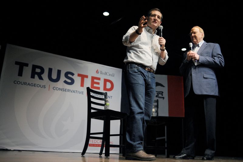 FILE PHOTO: Ted Cruz speaks with Dr. James Dobson (R), an evangelical Christian author, at a town hall at Winterset Stage in Winterset, Iowa January 4, 2016. REUTERS/Mark Kauzlarich/File Photo