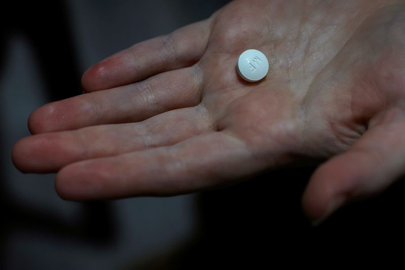 FILE PHOTO: A patient prepares to take Mifepristone, the first pill in a medical abortion, at Alamo Women's Clinic in Carbondale, Illinois, U.S., April 9, 2024. REUTERS/Evelyn Hockstein/File Photo