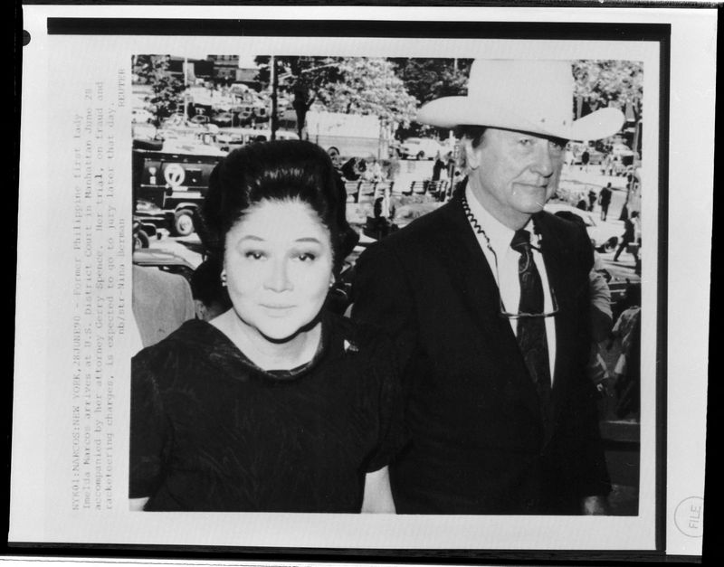 FILE PHOTO: Former Philippine first lady Imelda Marcos arrives at court with lawyer Gerry Spence.  June 28, 1990 REUTERS/Nina Berman/File Photo