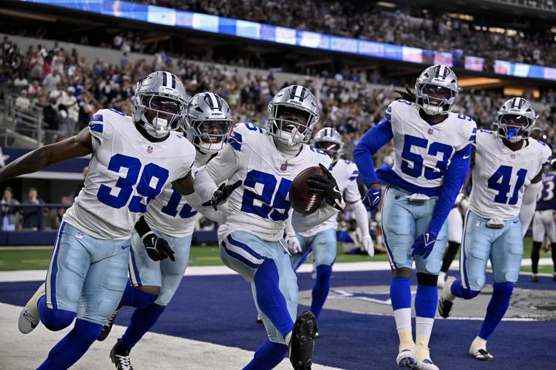FILE PHOTO: Aug 16, 2025; Arlington, Texas, USA; Dallas Cowboys cornerback Andrew Booth (25) and safety Mike Smith Jr. (39) and linebacker James Houston (53) celebrate after Booth returns a interception for touchdown against the Dallas Cowboys during the first quarter at AT&T Stadium. Mandatory Credit: Jerome Miron-Imagn Images/File Photo