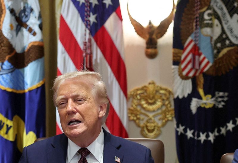 FILE PHOTO: U.S. President Donald Trump reacts during a cabinet meeting at the White House in Washington, D.C., U.S., August 26, 2025. REUTERS/Jonathan Ernst/File photo