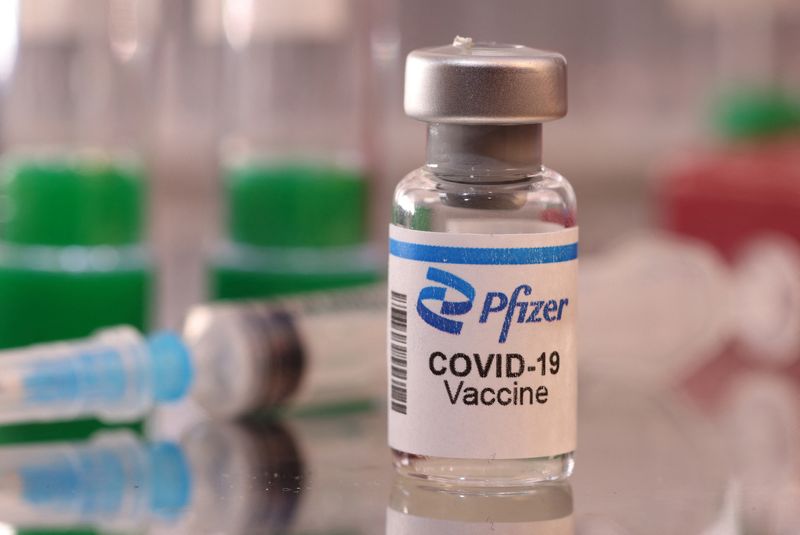 A vial labelled "Pfizer COVID-19 Vaccine" is seen in this illustration taken January 16, 2022. REUTERS/Dado Ruvic/Illustration