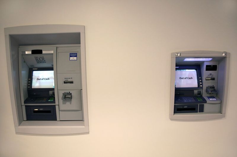 FILE PHOTO: Automatic teller machines (ATM) are seen out of cash in Washington, U.S., October 14, 2017. REUTERS/Yuri Gripas/FIle Photo