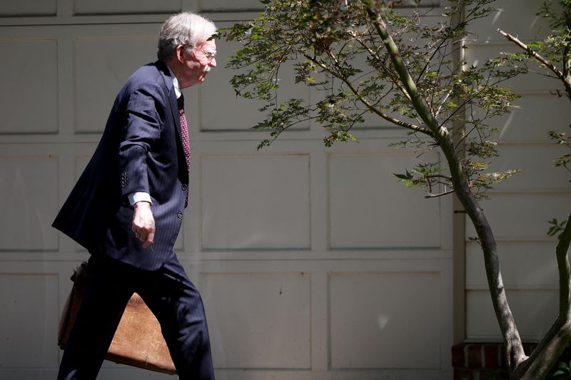 FILE PHOTO: Former White House national security adviser John Bolton arrives at his house following its search by the FBI, in Bethesda, Maryland, U.S., August 22, 2025. REUTERS/Tasos Katopodis/ File Photo