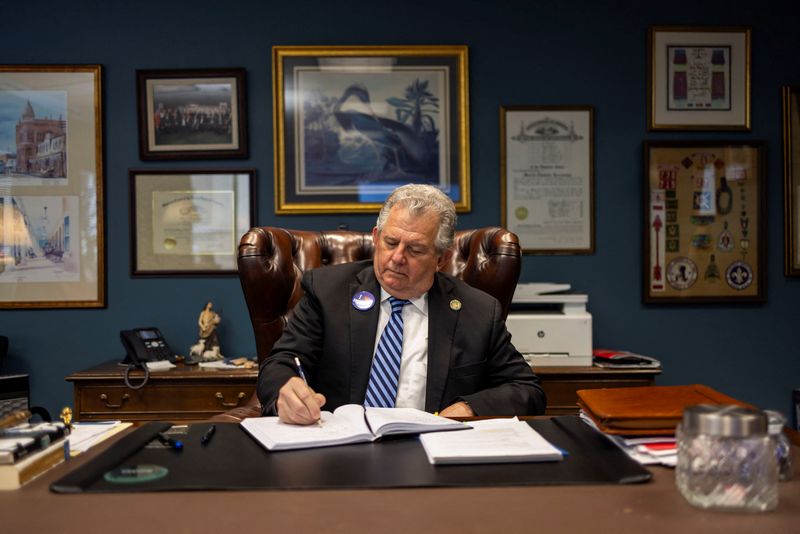 Shreveport's Mayor Tom Arceneaux sits at a desk in his office, in Shreveport, Louisiana, U.S., September 4, 2025. REUTERS/Kathleen Flynn