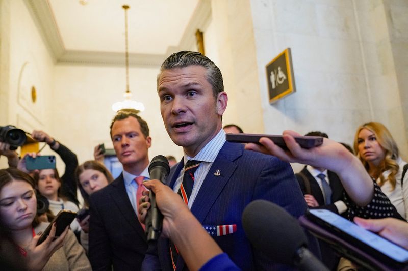 Defense secretary nominee Pete Hegseth speaks with the media as he departs a meeting on Capitol Hill in Washington, U.S., November 21, 2024. REUTERS/Nathan Howard