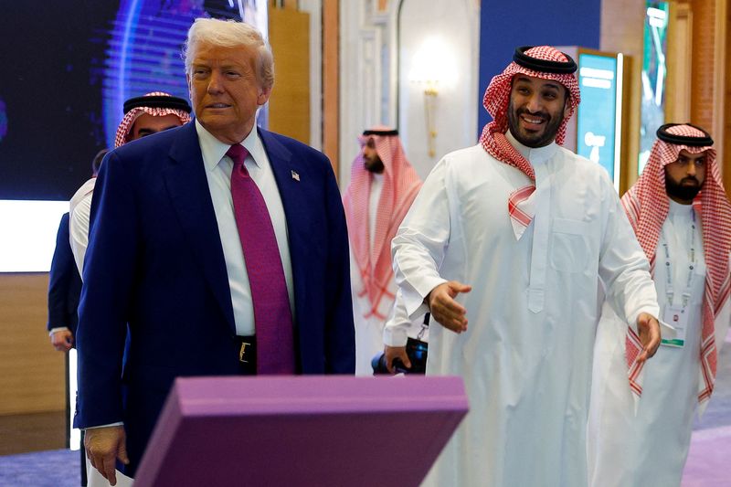 Saudi Crown Prince Mohammed Bin Salman reacts next to U.S. President Donald Trump during the Saudi-U.S. Investment Forum, in Riyadh, Saudi Arabia, May 13, 2025. REUTERS/Brian Snyder/File Photo
