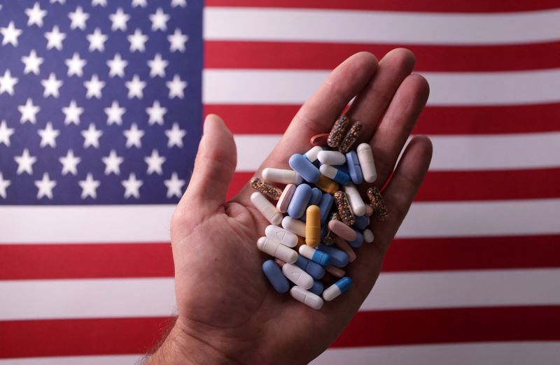 U.S. flag and medicines are seen in this illustration taken, June 27, 2024. REUTERS/Dado Ruvic/Illustration/File Photo