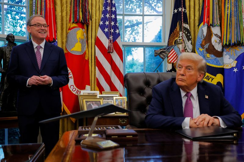 U.S. President Donald Trump listens as National Economic Council Director Kevin Hassett speaks with the media in the Oval Office, at the White House in Washington, D.C., U.S., September 5, 2025. REUTERS/Brian Snyder