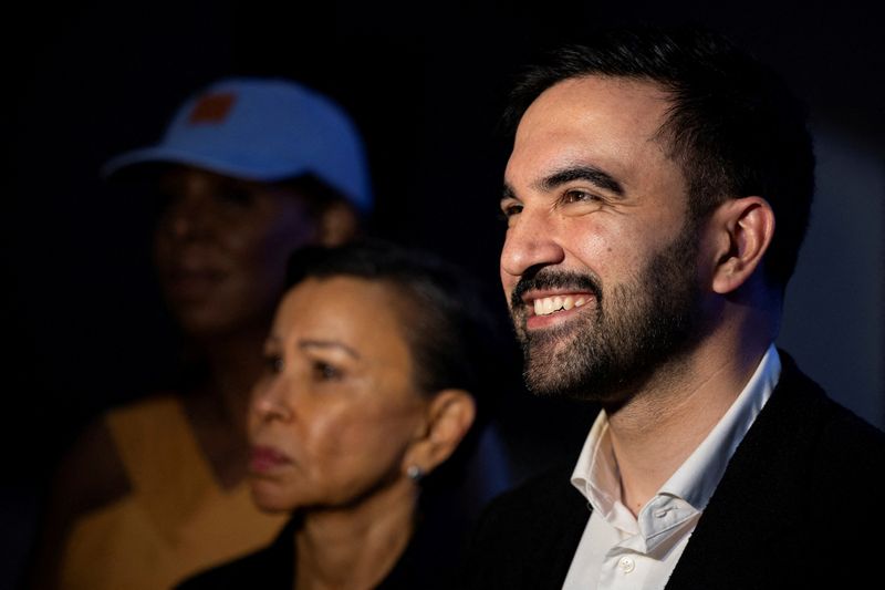 FILE PHOTO: New York City mayor-elect Zohran Mamdani smiles while standing alongside U.S. Representative Nydia Velazquez during an event in San Juan, Puerto Rico, November 6, 2025. REUTERS/Ricardo Arduengo/File Photo