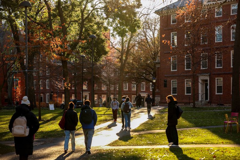 Students walk on campus at Harvard University in Cambridge, Massachusetts, U.S., November 19, 2025. REUTERS/Reba Saldanha
