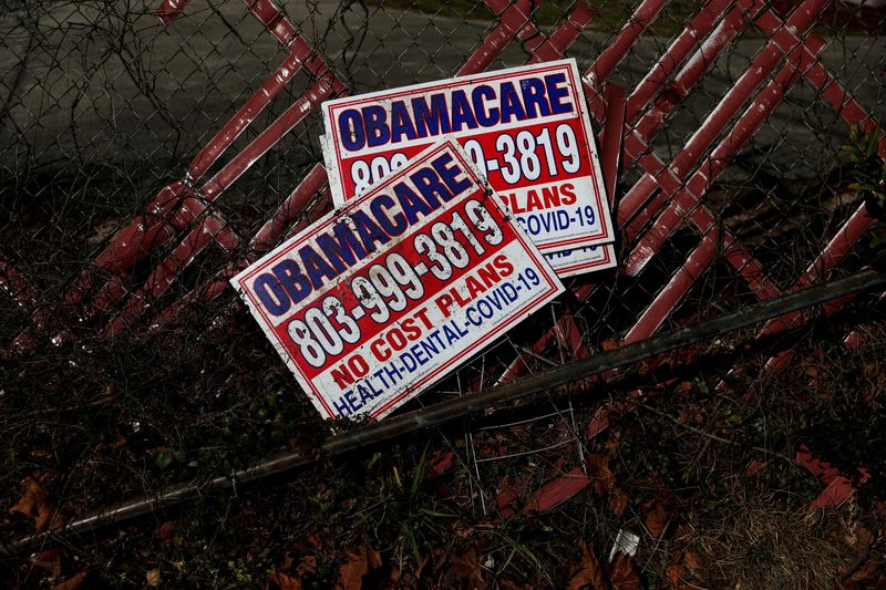 FILE PHOTO: Signs for former Obamacare health insurance plans lay next to a fence in Columbia, South Carolina, U.S., January 28, 2023. REUTERS/Shannon Stapleton/File Photo