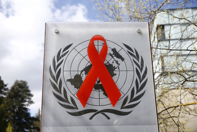 A logo is pictured outside a building of the United Nations AIDS agency (UNAIDS) in Geneva, Switzerland, April 6, 2021. REUTERS/Denis Balibouse