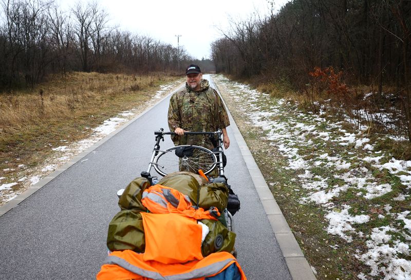British ex-paratrooper Karl Bushby who has been walking across the world for 27 years, smiles during his trip in Komarom, Hungary, November 25, 2025. REUTERS/Bernadett Szabo