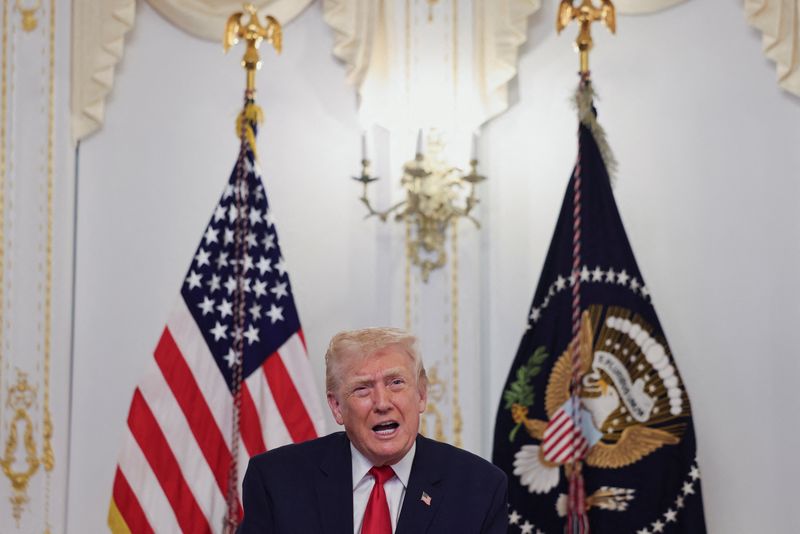 U.S. President Donald Trump participates in a call with service members of U.S. Army, JTF-Southern Border, 101st Airborne Division (Fort Huachuca, AZ), U.S. Marine Corps, Battalion Landing Team 3d Battalion 6th Marines (Puerto Rico), U.S. Navy, IWO JIMA ARG, 22 MEU, (Underway, SOUTHCOM AOR), U.S. Air Force, 7th Bomb Wing (Dyess AFB, Abilene, TX), U.S. Space Force, 18th Space Defense Squadron (Vandenberg Space Force Base, CA), and U.S. Coast Guard, USCGC FORREST REDNOUR, WPC-1129 (Underway), on Thanksgiving, in Palm Beach, Florida, U.S., November 27, 2025. REUTERS/Anna Rose Layden