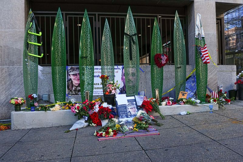 A makeshift memorial at the site of a shooting of two National Guard members in Washington, U.S., December 1, 2025. REUTERS/Aaron Schwartz