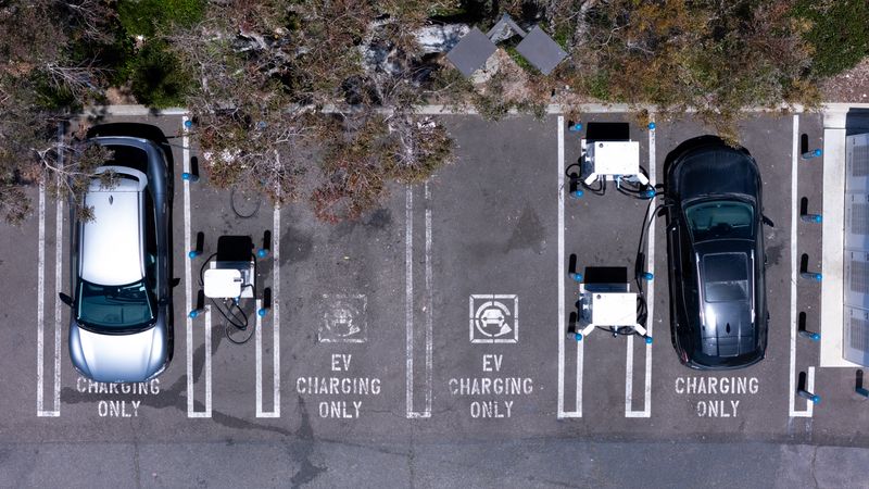 An electric vehicle charging location is shown from the view of a drone in Carlsbad, California, U.S., May 14, 2025. REUTERS/Mike Blake