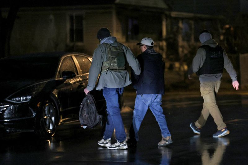 FILE PHOTO: Federal officers carrying out U.S. immigration enforcement near Maryland, U.S. February 6, 2025.