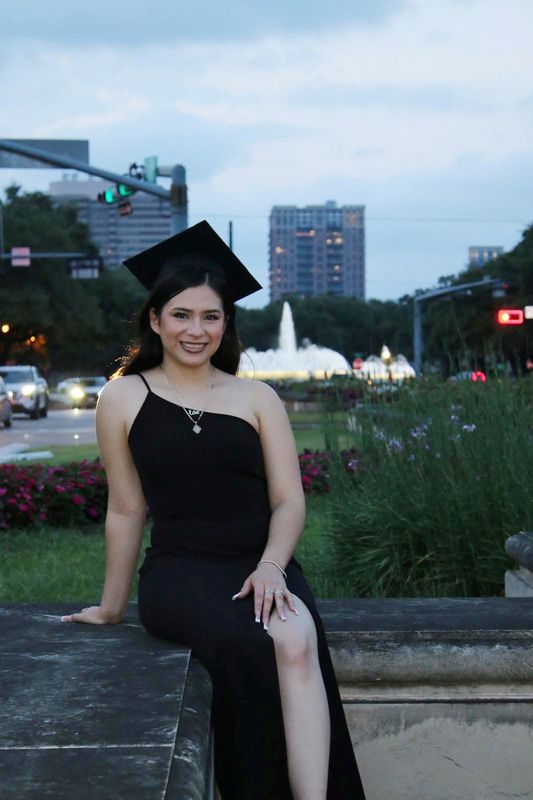Babson College student Any Lucia Lopez Belloza poses wearing a mortarboard after graduating from high school in Boston, Massachusetts, U.S., in 2025. massdeportationdefense.org/Handout via REUTERS