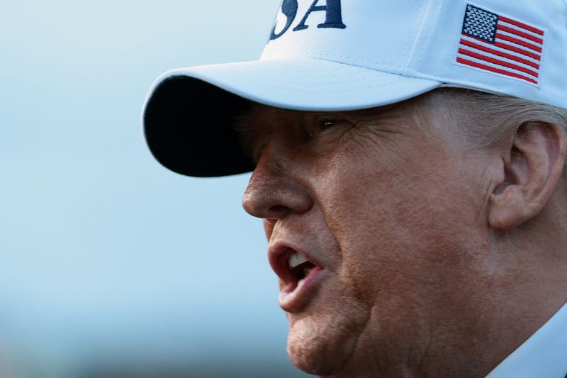 U.S. President Donald Trump speaks to reporters, on his return from Detroit, Michigan, at Joint Base Andrews, Maryland, U.S., January 13, 2026. REUTERS/Evelyn Hockstein