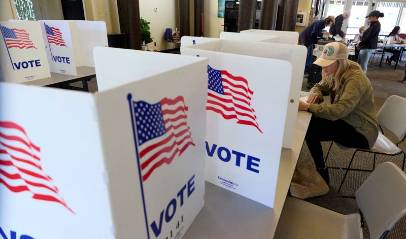 FILE PHOTO: A voter fills out a ballot at an El Dorado County polling station during California’s special election on Proposition 50, a measure that would temporarily redraw congressional districts, in El Dorado Hills, California, U.S., November 4, 2025. REUTERS/Fred Greaves/File Photo