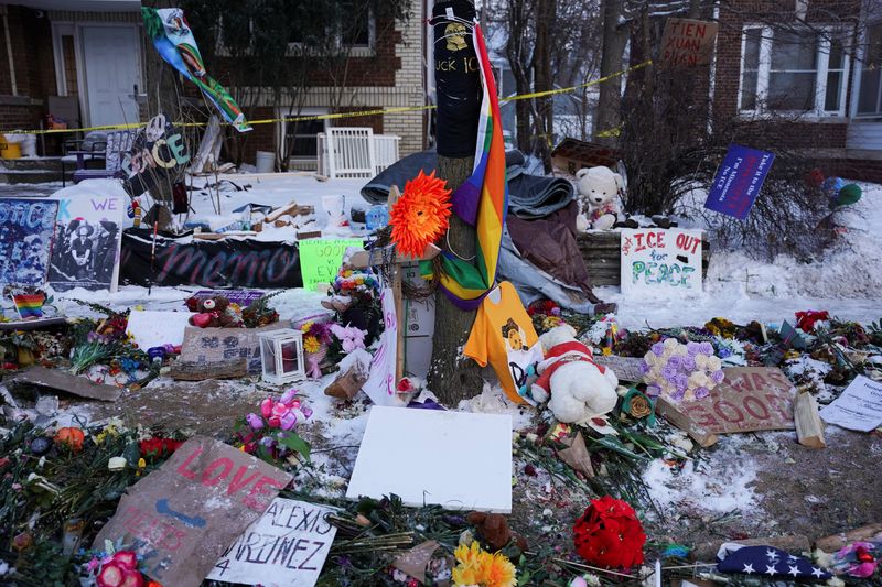 Flowers, toys and signs lie at a makeshift memorial at the site of the fatal shooting of Renee Nicole Good by a U.S. Immigration and Customs Enforcement (ICE) agent on January 7, in Minneapolis, Minnesota, U.S., January 21, 2026. REUTERS/Seth Herald