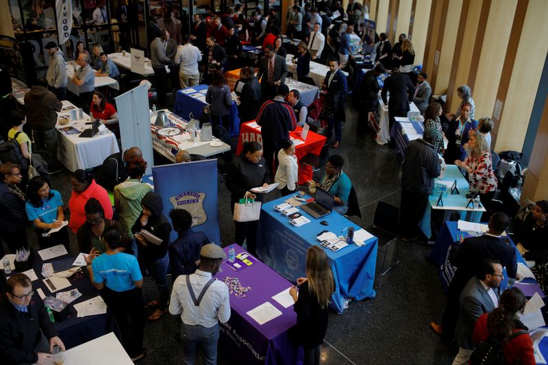 Job seekers speak with potential employers at a City of Boston Neighborhood Career Fair on May Day in Boston, Massachusetts, U.S., May 1, 2017.   REUTERS/Brian Snyder