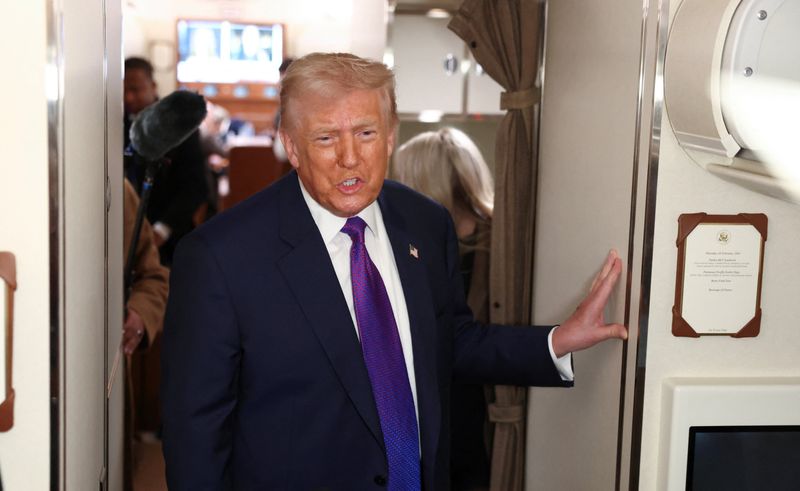 U.S. President Donald Trump speaks to reporters aboard Air Force One, February 19, 2026. REUTERS/Kevin Lamarque