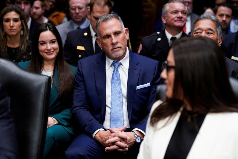 FILE PHOTO: Shawn DeRemer, husband of Lori Chavez-DeRemer, U.S. President Trump’s nominee to be secretary of labor, sits, on the day Chavez-DeRemer testifies before a Senate Health, Education, Labor, and Pensions (HELP) Committee confirmation hearing on Capitol Hill in Washington, D.C., U.S., February 19, 2025. REUTERS/Kent Nishimura/File Photo