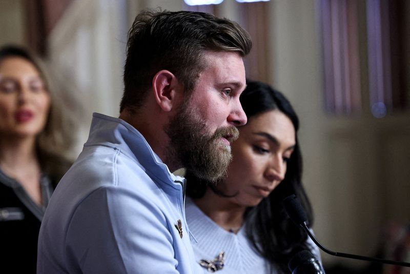 FILE PHOTO: Virginia Giuffre's brother, Sky Roberts, and his wife, Amanda Roberts, speak as they take part in introducing Virginia's Law, legislation that aims to eliminate the statute of limitations for sex traffickers and abusers, with survivors of late financier and convicted sex offender Jeffrey Epstein and U.S. Senate Minority Leader Chuck Schumer (D-NY) (not pictured), on Capitol Hill in Washington, D.C., U.S., February 10, 2026. REUTERS/Anna Rose Layden/File Photo