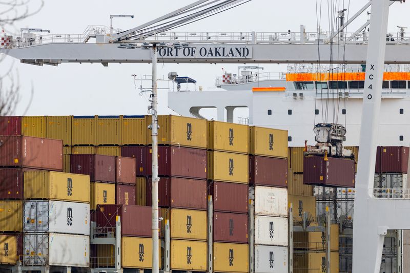 Shipping containers at the port of Oakland following the Supreme Court's ruling that Trump had exceeded his authority when he imposed tariffs, in Oakland, California, U.S., February 23, 2026. REUTERS/Carlos Barria