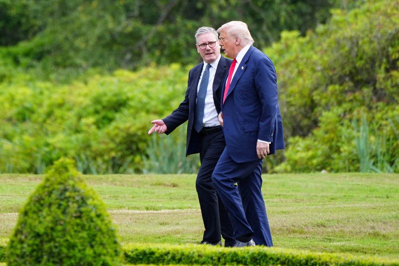FILE PHOTO: U.S. President Donald Trump walks with British Prime Minister Keir Starmer at Trump International Golf Links, in Aberdeen, Scotland, Britain, July 28, 2025.    Jane Barlow/Pool via REUTERS/File Photo