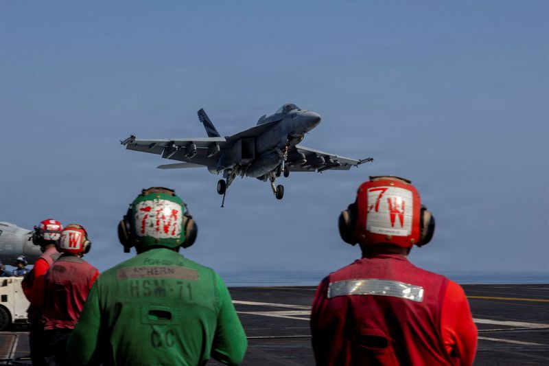 An F/A-18E Super Hornet prepares to make an arrested landing on the flight deck of the U.S. Navy Nimitz-class aircraft carrier USS Abraham Lincoln in support of the Operation Epic Fury attack on Iran from an undisclosed location March 2, 2026.  U.S. Navy/Handout via REUTERS