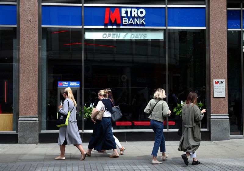 People walk past a Metro Bank in London, Britain, May 22, 2019. REUTERS/Hannah McKay